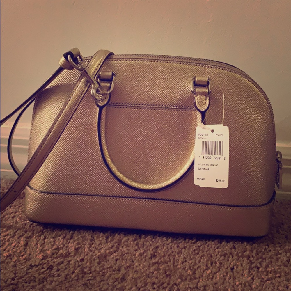 Bronze coach handbag and wallet with straps
